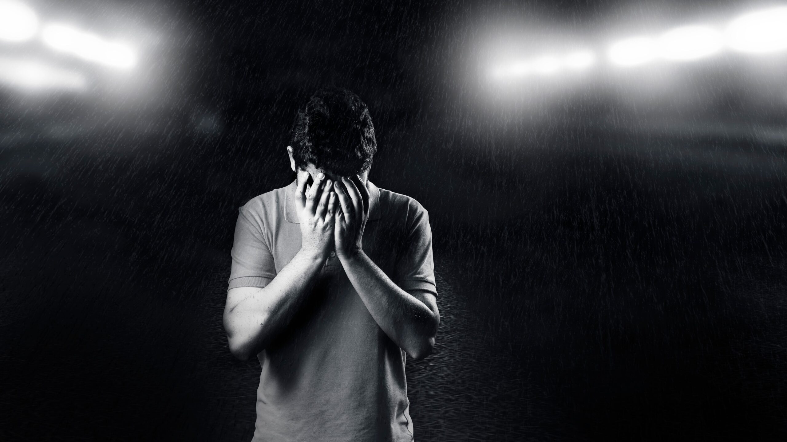Man in distress in the rain — men's mental health Singapore